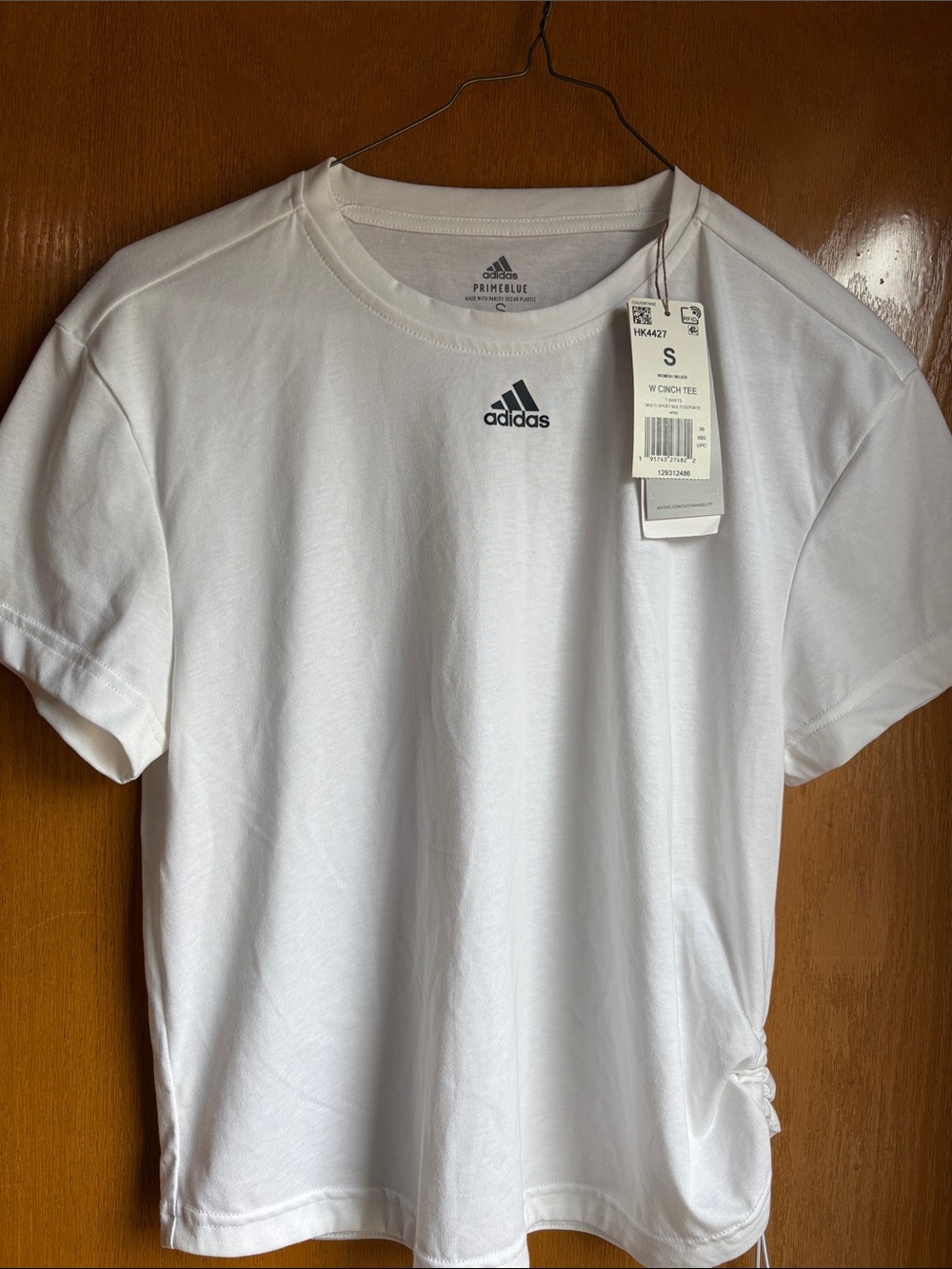 adidas White Short Sleeve chinch PRIMEBLUE shirt.
